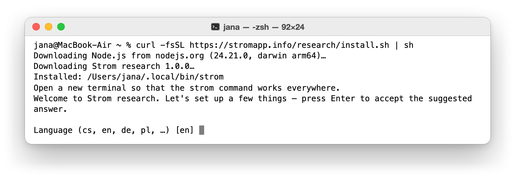 The pasted line in the terminal: Node.js and Strom Research download, then the setup starts